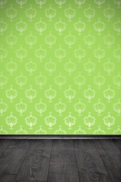 Blank wall with green floral wallpaper and wooden floor