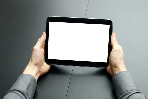 Businessman holding blank digital tablet