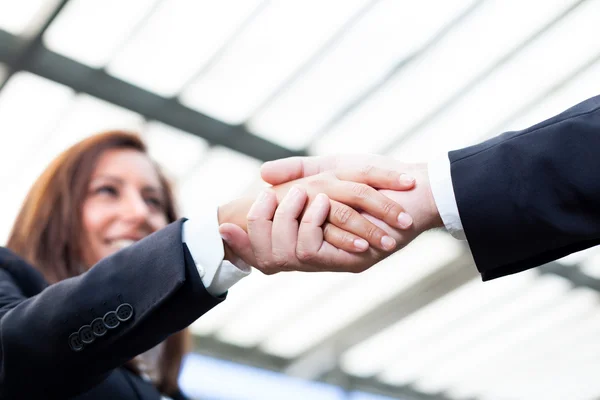 Businesspeople shaking hands at the office