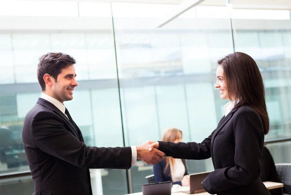 Business handshake at modern office with bussiness