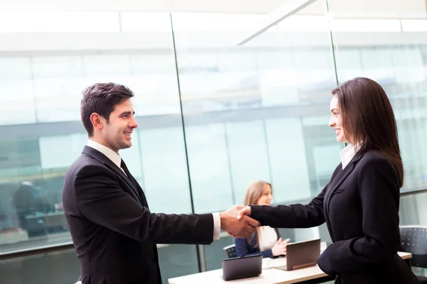 Business shaking hands, finishing up a meeting at the off