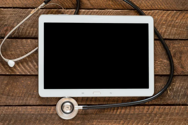 Medical stethoscope on modern digital tablet