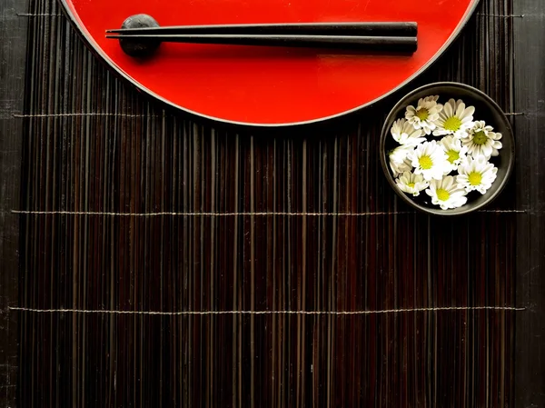 Chopsticks,flowers and Japanese red tray