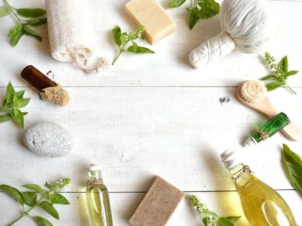Aromatherapy supplies with basil leaves