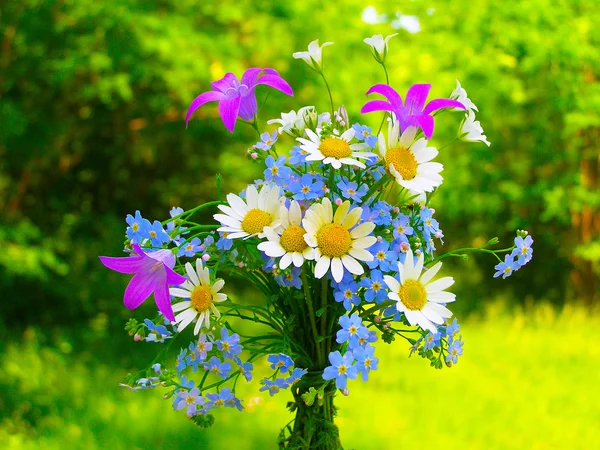 Bright colorful bouquet of garden and wild natural flowers