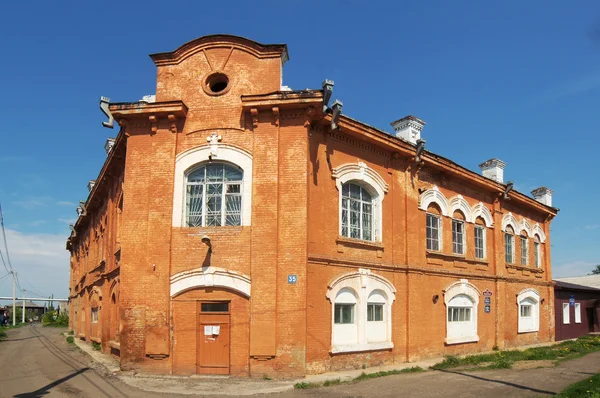Old brick house built in the late 19th century in the town of Mariinsk, Kemerovskaya region, Siberia, Russia