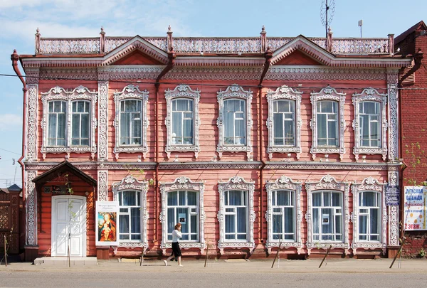 Old wooden house built in the late 19th century in the town of Mariinsk, Kemerovskaya region, Siberia, Russia
