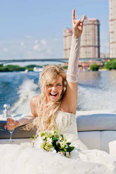 Happy bride on a boat floats