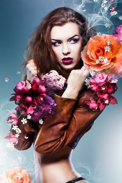 Pretty attractive erotic woman in brown jacket with big flowers