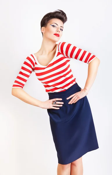 Interesting cute woman in striped t-shirt and skirt