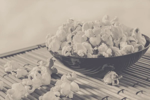 Popcorn over filled in bowl, vintage edited