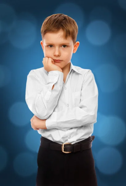 Boy child businessman thinks solves problem in white shirt and t