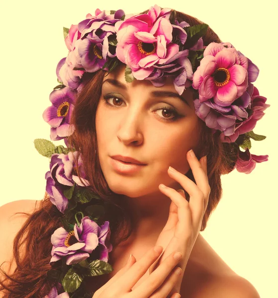 Beauty model beautiful woman face close-up , wreath flowers her