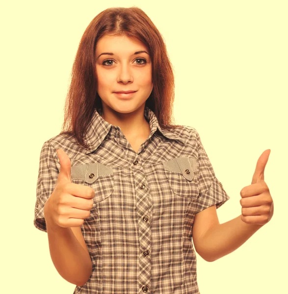 Woman brunette young girl shows positive sign thumbs yes, shirt