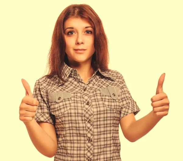 Young woman brunette girl shows positive sign thumbs yes, shirt