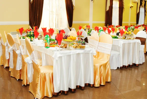 Interior of restaurant with the covered tables