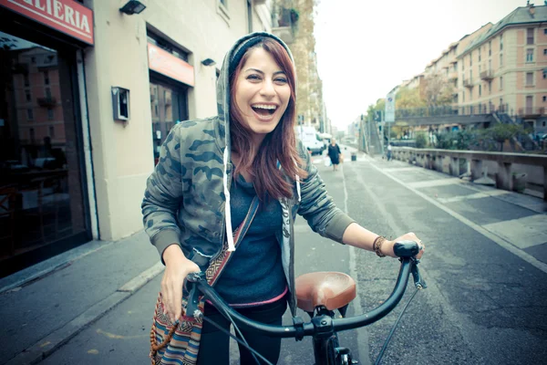 Beautiful red head woman on bike