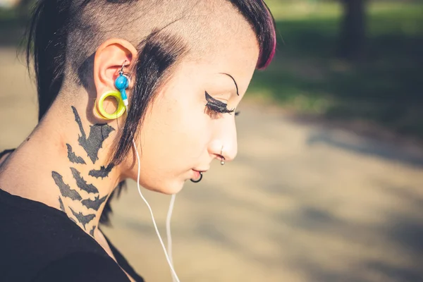 Punk girl listening music
