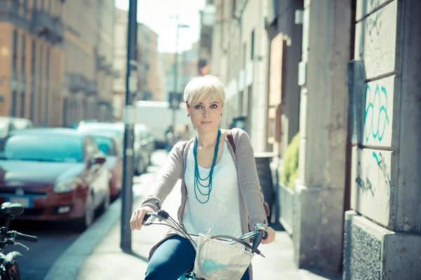 Hipster woman with bike
