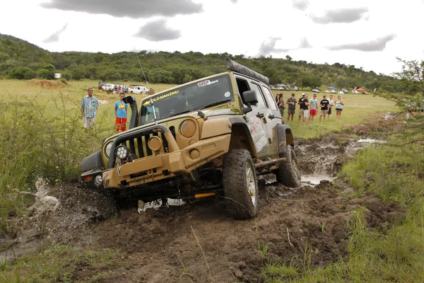 Gecko Pearl Green Jeep Wrangler Rubicon crossing mud obstacle
