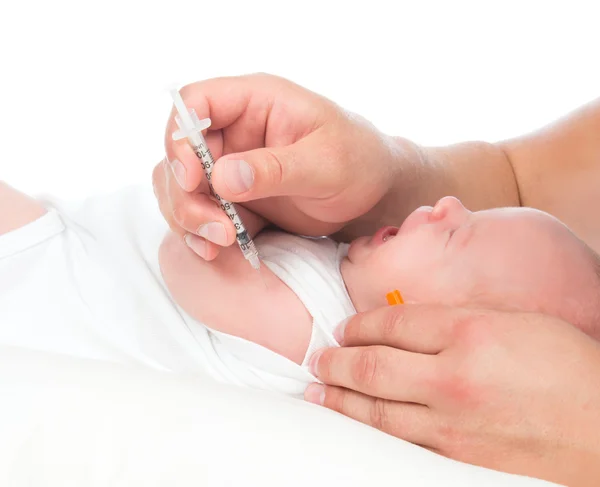 Doctor vaccinating child baby flu injection shot i