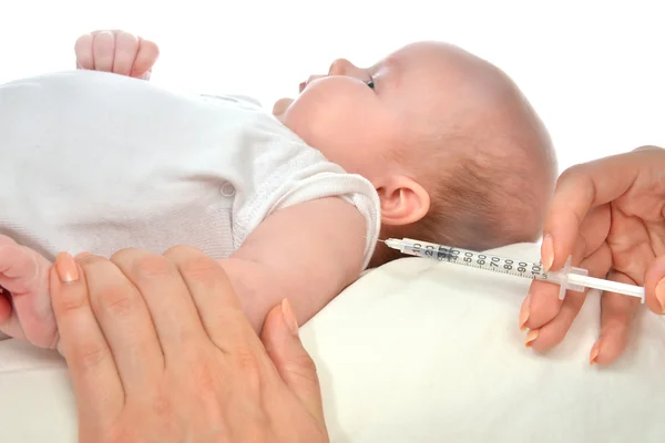 Doctor vaccinating child baby flu injection shot