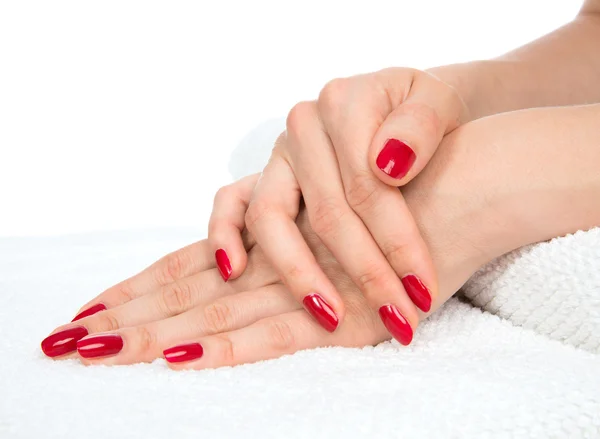 Kin and nail care concept manicured red nails