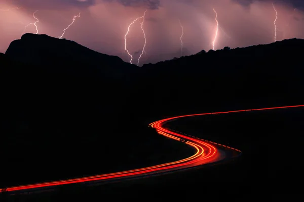 The road in the mountains during a thunderstorm
