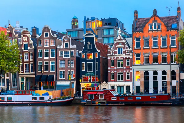 Night city view of Amsterdam canal with dutch houses