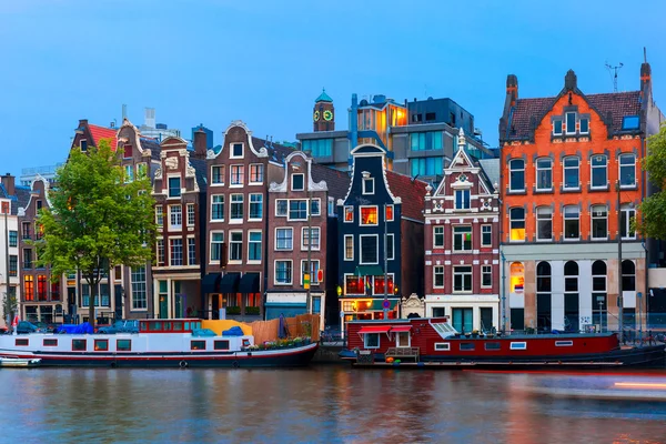 Night city view of Amsterdam canal with dutch houses