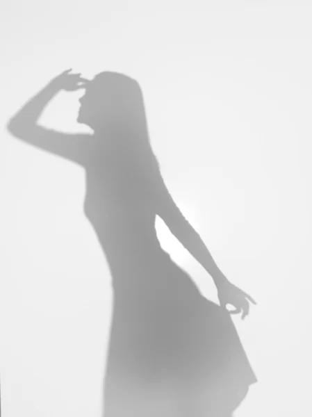 Woman silhouette seeking for something far away