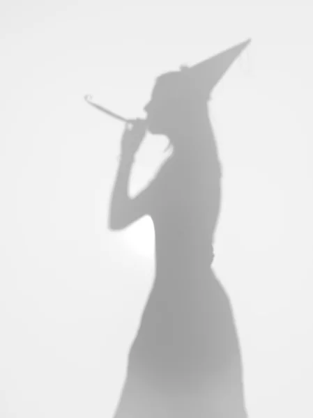 Girls with party hat and horn, silhouette