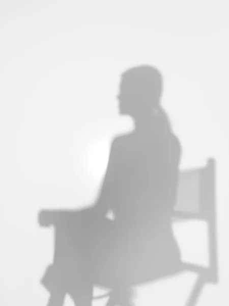 Woman on director\'s chair, silhouette