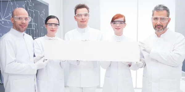 Confident scientists in lab