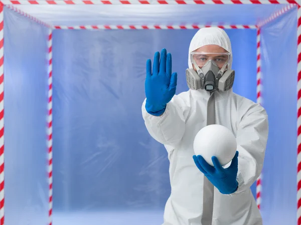 Person in biohazard suit warns against contaminantion