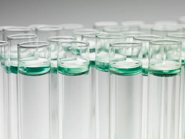 Laboratory test tubes filled with liquid substances