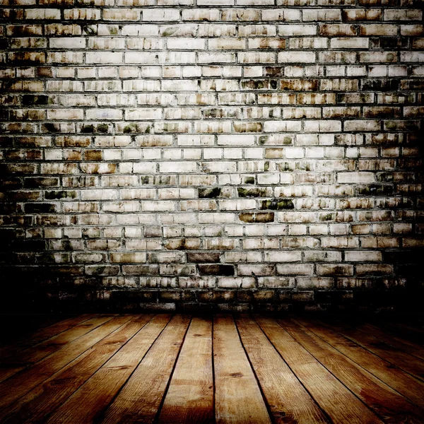 Room. The brown brick texture and wood floor with natural patterns background