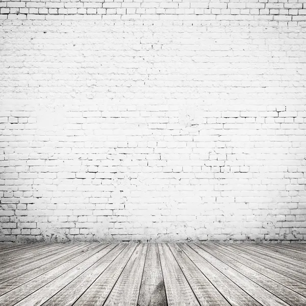 White brick wall and wood floor background