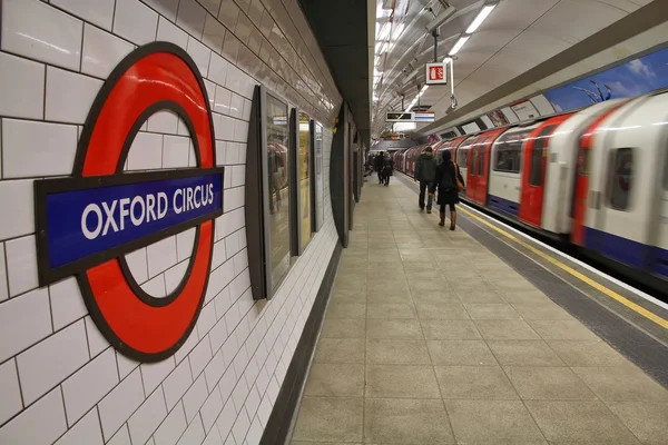 Travelers hurry at Oxford Circus underground station