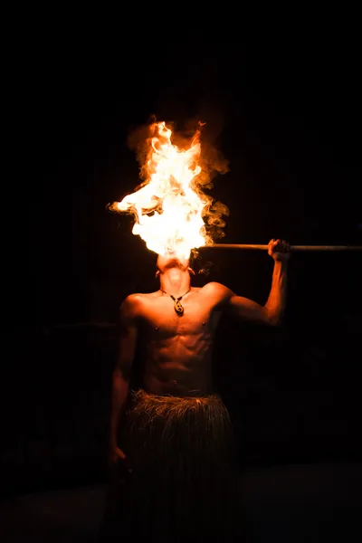 Man demonstrates the fire breathing