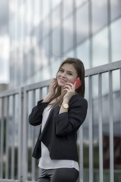 Business woman speaking cellphone on the street