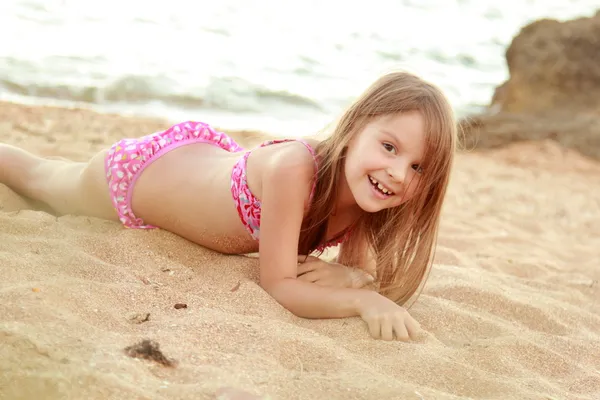 Little cute girl on beach