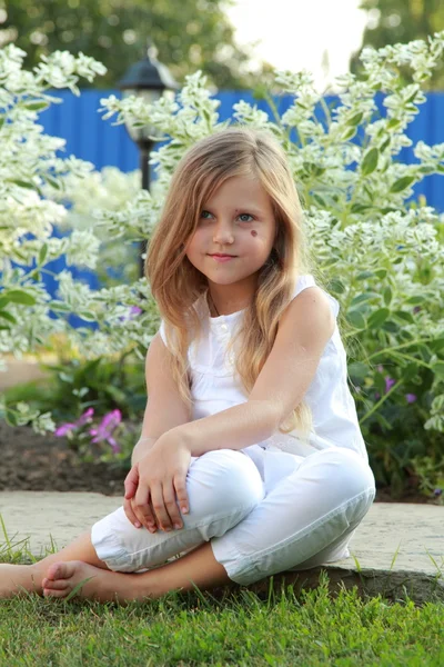 Little blond girl outdoors