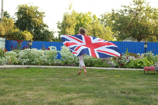 Young girl with the flag of the UK