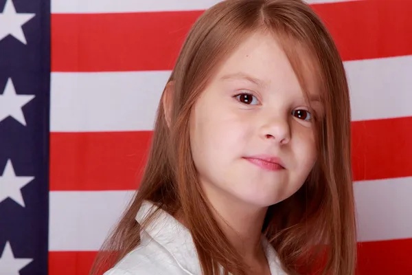 Girl against the background of the American flag