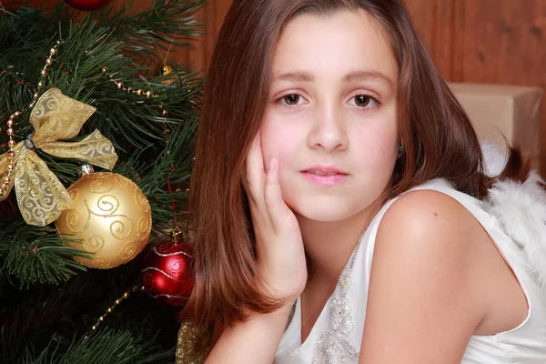 Little girl over Christmas tree