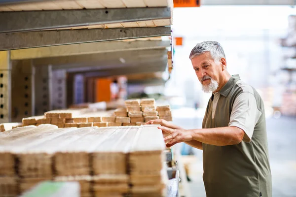 Man buying construction wood in a DIY store