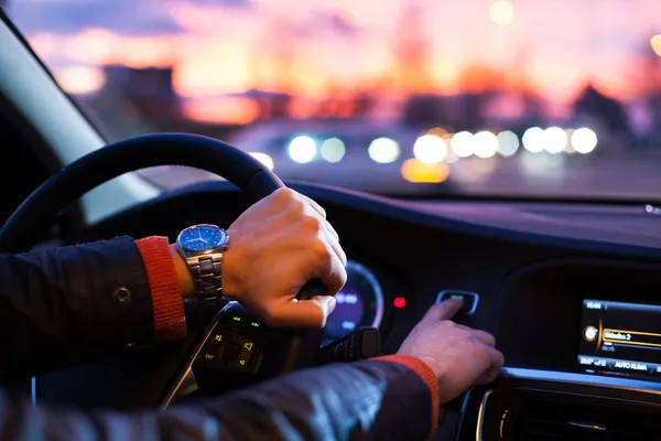 Driving a car at night -man driving his modern car at night