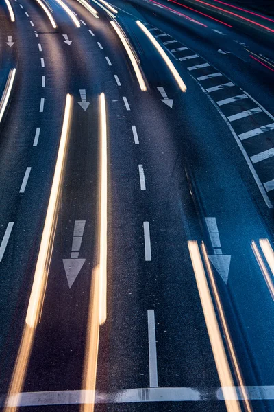 Motion blurred city road traffic (color toned  image)