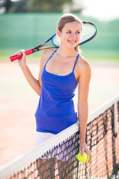 Young tennis player  on  a court